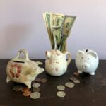 white ceramic teapot beside white ceramic teapot