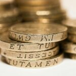 a pile of gold coins sitting on top of each other